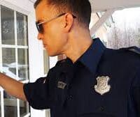 police officer knocking on door