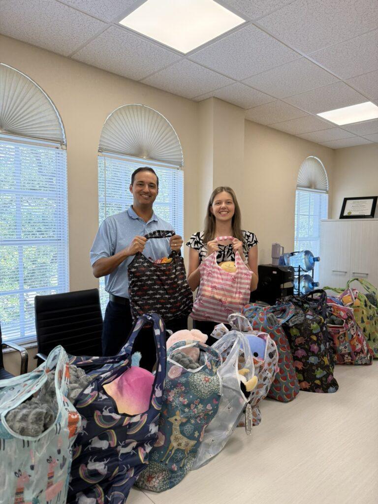 Patrick Iyampillai and Melanie packing care bags together