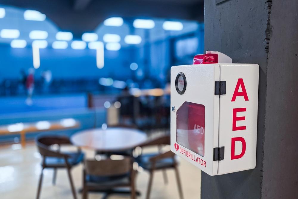 AED or Automated External Defibrillator installed on wall in Sports Gym as first aid in heart attack situation.